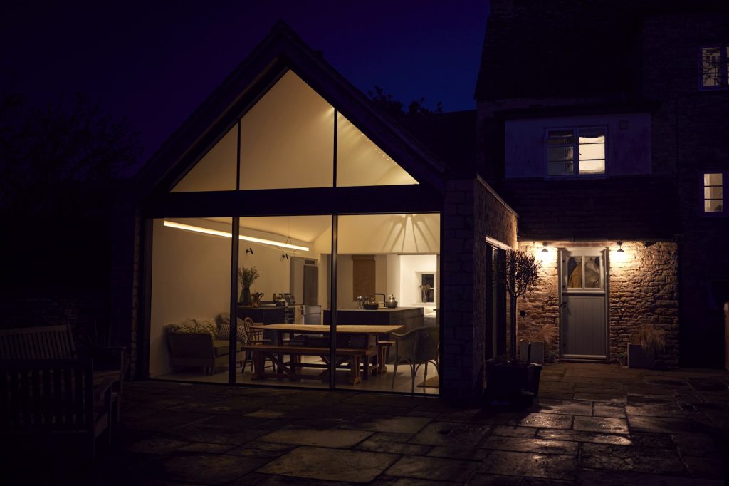 Exterior View Of Beautiful Kitchen Extension At Night